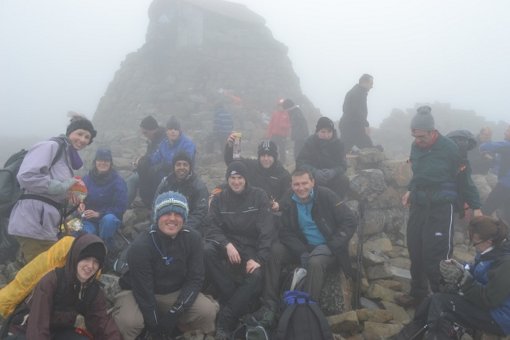 Ian Archer (centre with unzipped jacket over blue top) and colleagues make it to the top of Ben Nevis last Saturday.